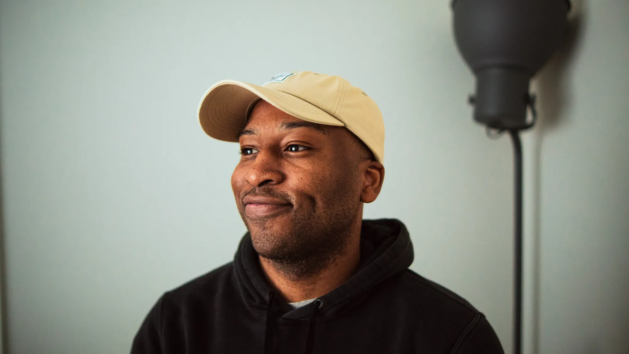 Bill Utaegbulam smiling for a photo.