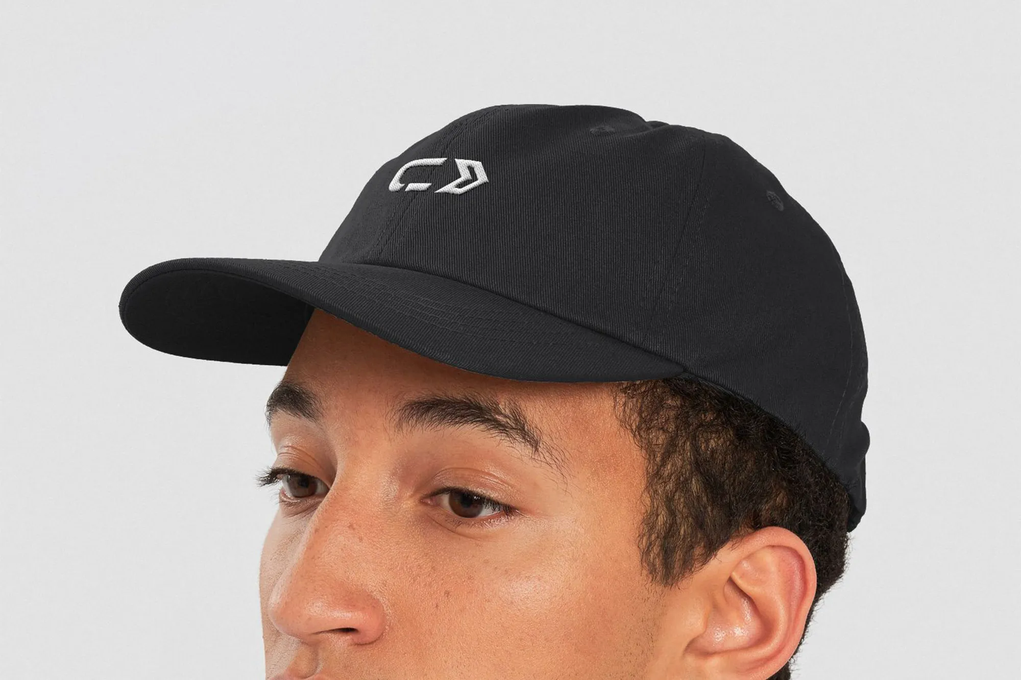 A man wearing acuSTEM Journeys branded baseball cap